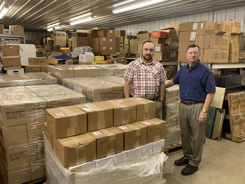 Ben Wilkerson and Brandon Harrell in the Revival Literature warehouse.